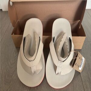 Beige Flip Flops with Red Soles